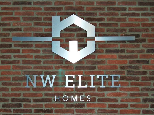 Silver New Elite Homes Sign with Logo