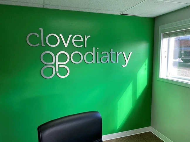 Silver 3D Text on Wall with Logo