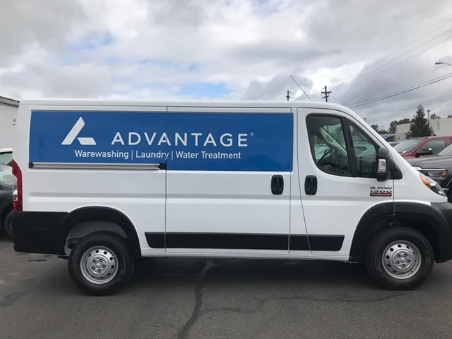 Blue and White Vehicle Wrap with Lettering and Logo
