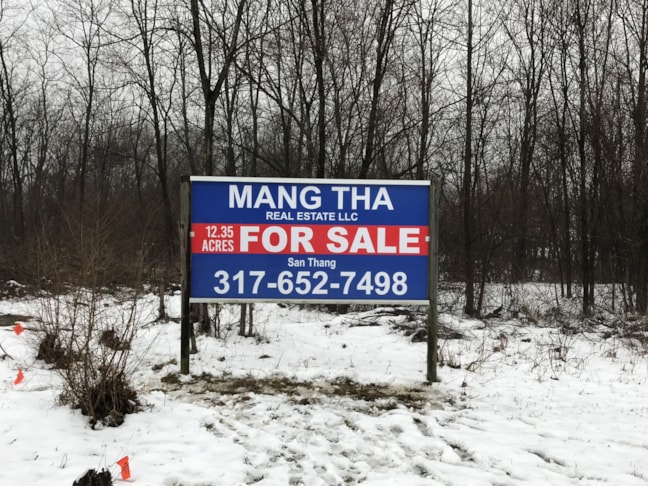 Post and Panel Sign for Mang Tha Real Estate in Indianapolis IN