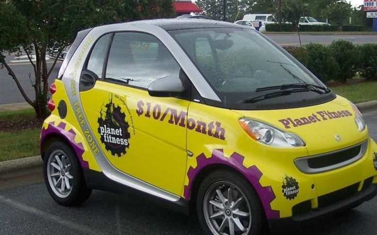 Digital and cut vinyl graphics on a Yellow car