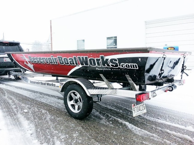 Signs Now Hanover designed, printed and installed this boat wrap for Reservoir Boat Works custom all electric boat.