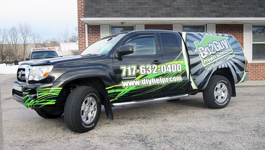 This partial vehicle wrap is more economical than a full wrap but does a great job of advertising for the client.