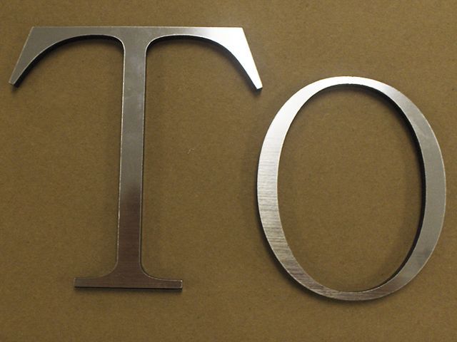 Acrylic Letters (Laser Cut) Overlaid with Brushed Chrome Romark