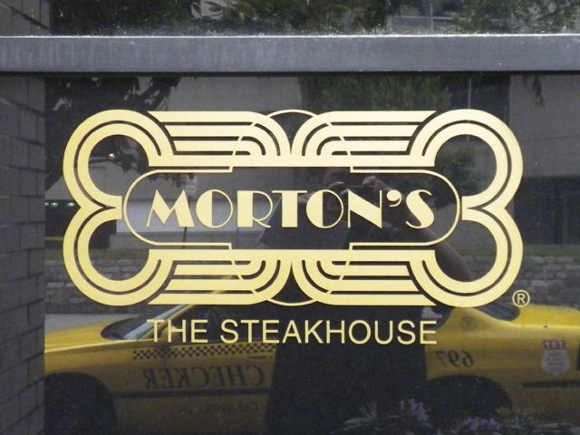 Lettering applied to windows of local, upscale steakhouse