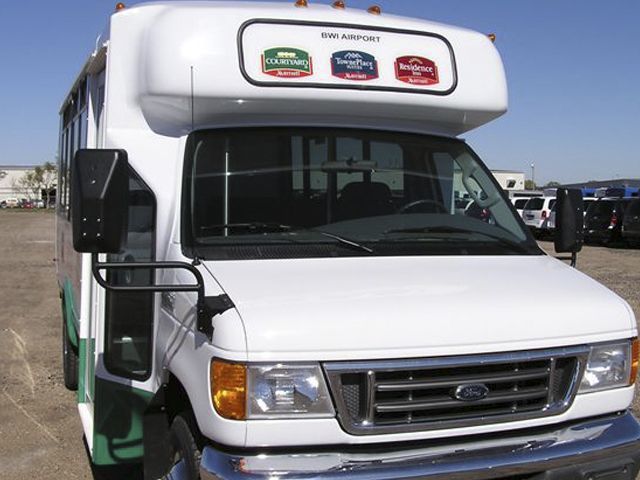 Translucent prints on front of airport shuttle