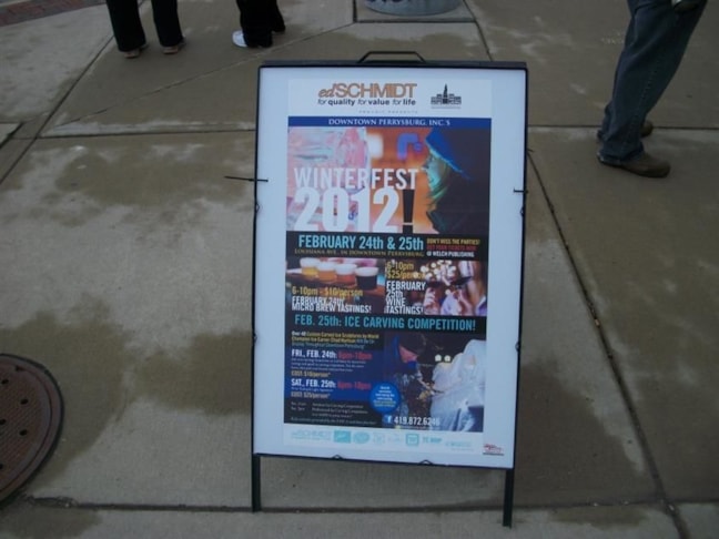 Digitally printed sidewalk sign showing times and events for Winterfest in Downtown Perrysburg.
