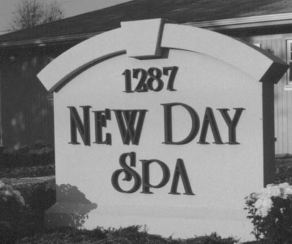 Customized monument sign complimenting the buildings architectural style