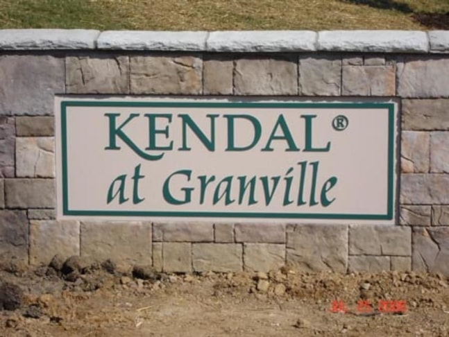 Dimensional sign customized to mesh with architectural structure of this building