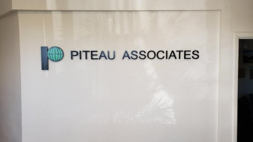 Individual plastic letters attached to wall for three dimensional look.