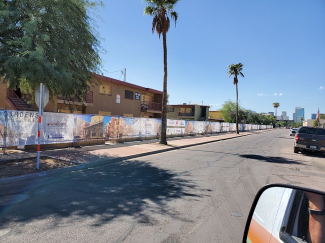 Mesh Banners installed around a construction site in Phoenix. 80, 15 x 5 banners installed in visual sequence.
