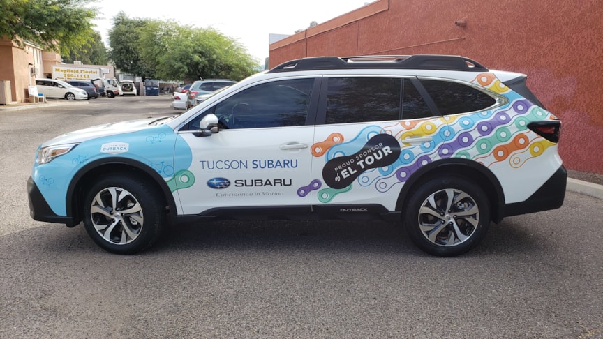 Wrapping a subaru as a pace car for the Tucson El Tour de Tucson bicycle event.
