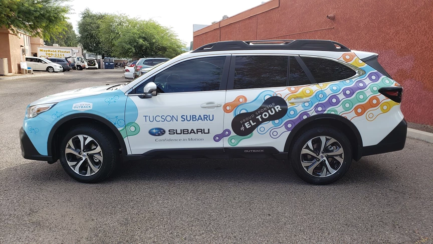 Wrapping a subaru as a pace car for the Tucson El Tour de Tucson bicycle event.