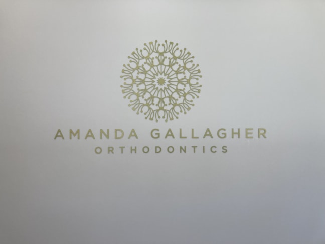 Cut gold vinyl on white wall