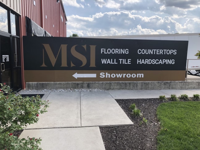 Metal Sign attached to railing 