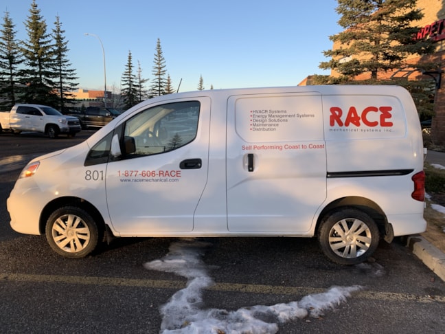 Cut vinyl letters applied to a white service van