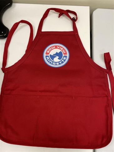 Promotional Products -- Cooking with team spirit! ???? These custom printed aprons for Bow View Ringette bring their colours off the ice and into the kitchen — perfect for volunteers, fundraisers, and fans alike.