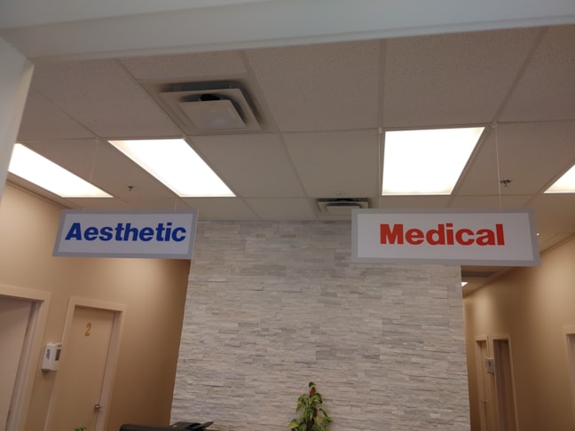 Bold and bright hanging signs to help your visitors find their destination in your office.