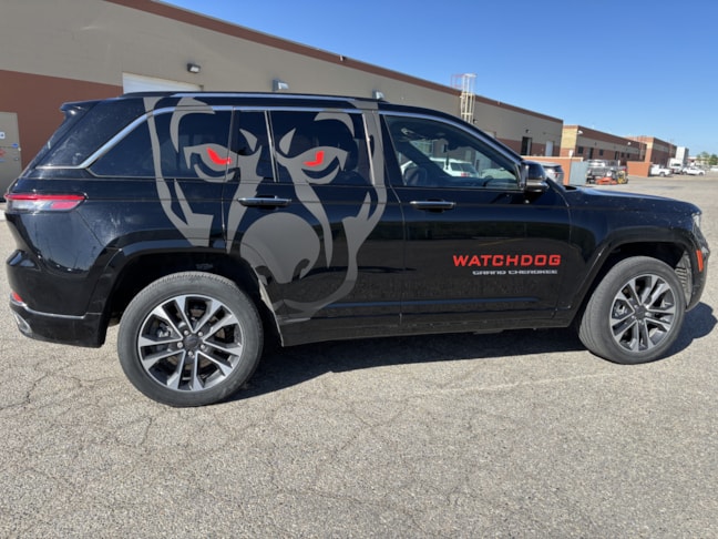 Vehicle Graphics & Lettering:  Subtle but fierce. These black-on-black matte vehicle graphics for Watchdog Security are all about stealth style—with red reflective eyes that demand a second look.