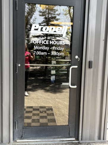 Window Graphics:  Clean, clear, and built to last—white cut vinyl graphics on Propell’s exterior doors boost visibility and brand presence right at the entrance.