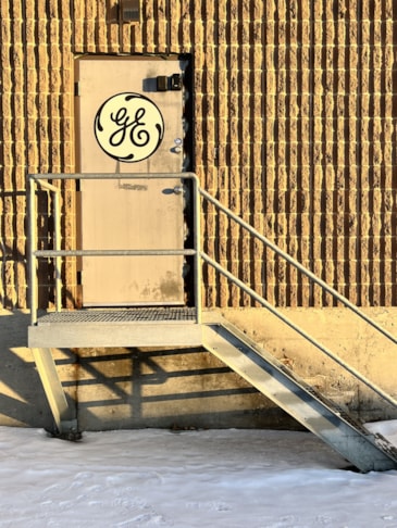 Magnetic Signs adheres to metal man doors -- custom print of your logo and cut to shape