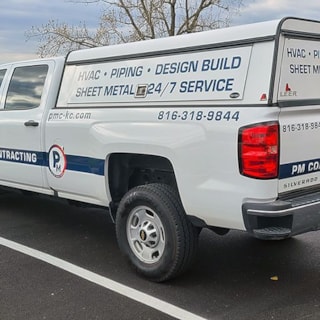 Partial Camper Truck Graphics for PM Contracting in Grandview, Missouri