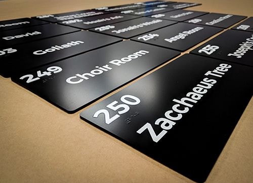 Interior ADA Disability Room Number Wayfinding Signs for Woods Chapel United Methodist Church in Lees Summit, Missouri