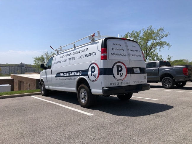 Partial Vehicle Fleet Graphics for PM Contracting in Grandview, Missouri