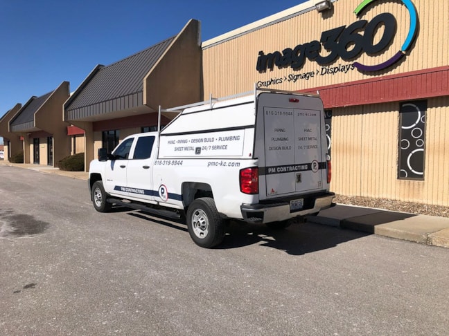 Partial Vehicle Fleet Graphics for PM Contracting in Grandview, Missouri