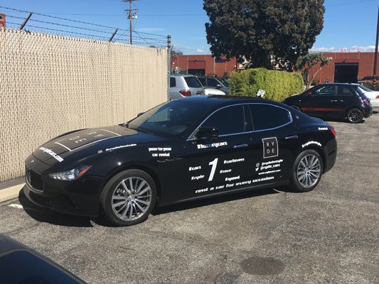 white vinyl lettering maserati race car custom installation.jpg