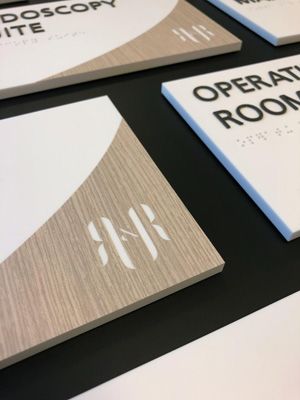 custom acrylic ADA torrance medical center installation wood vinyl ADA die cut detail.jpg