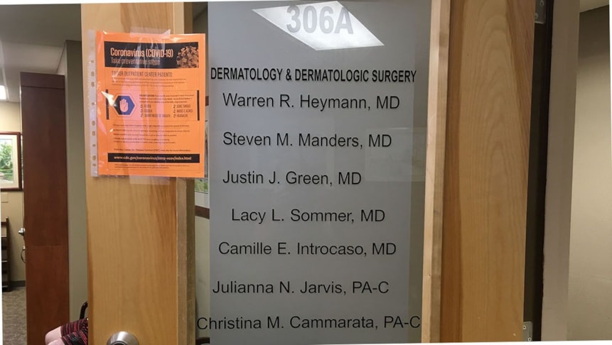 New door graphics for the dermatology office after hiring a new doctor.