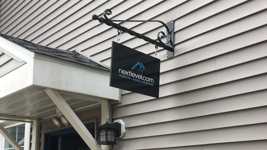 MDO signage with NextLevels custom logo printed on vinyl overlay.