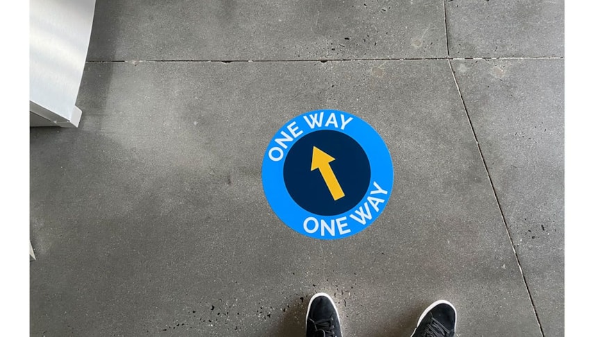 Social distancing floor graphics to maintain safety in the office.