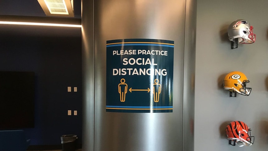 Social distancing reminder printed as a vinyl decal for the office.