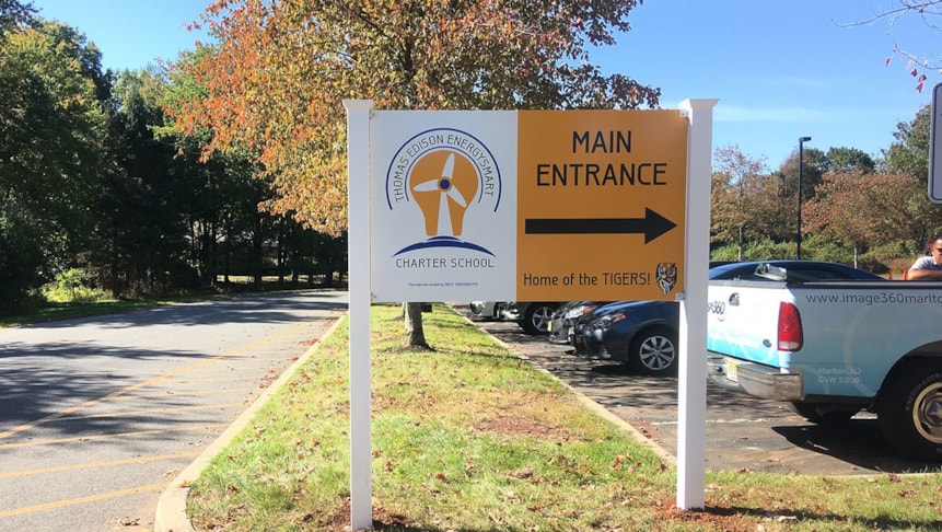 Directional post and panel signage for Thomas Edison EnergySmart Charter school to help parents navigate their way to the schools office.