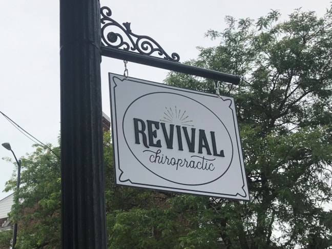 Hanging Sign with Ornamental Bracket and 1/4 raised letters.