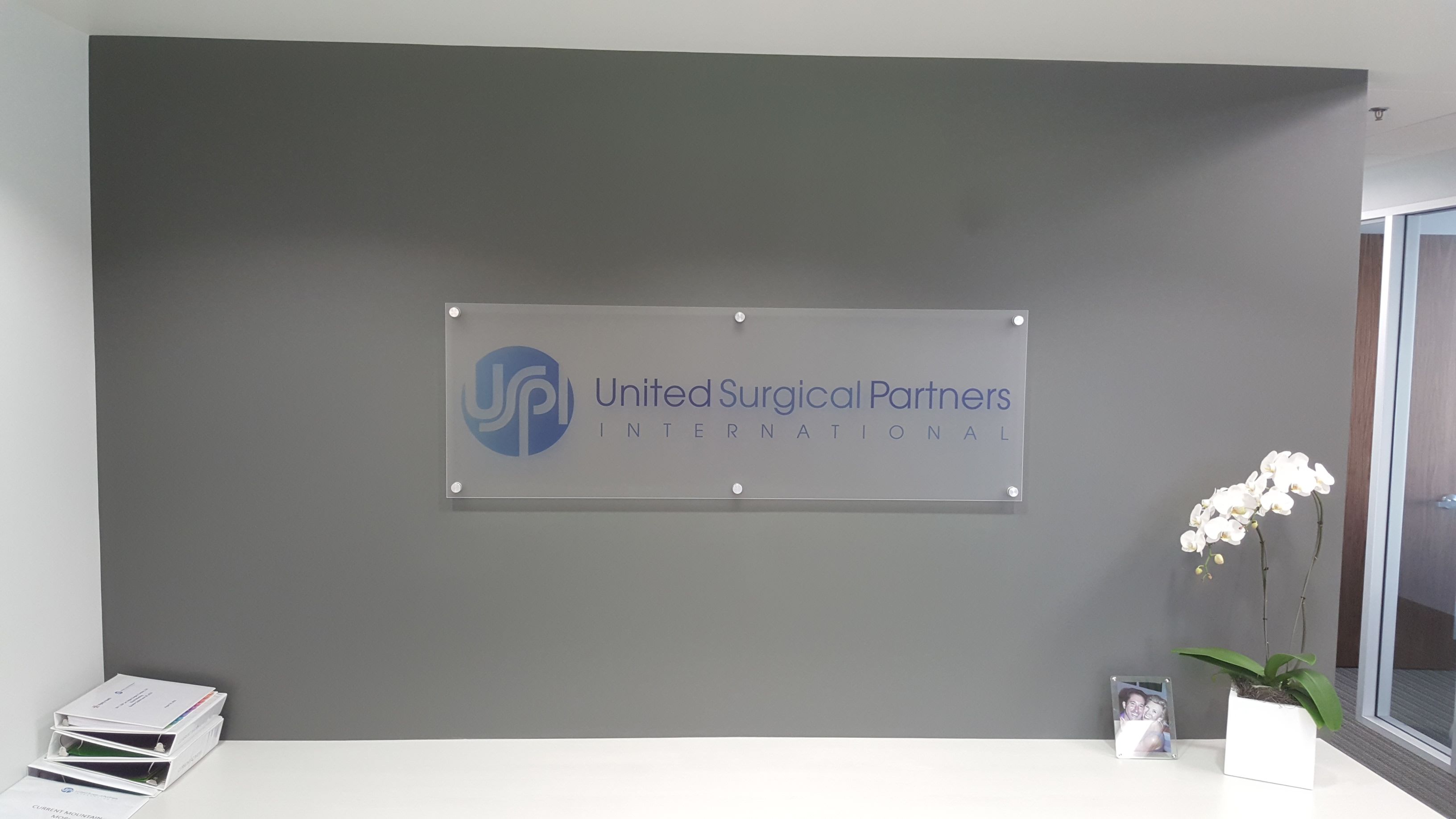 Architectural reception signage united surgical