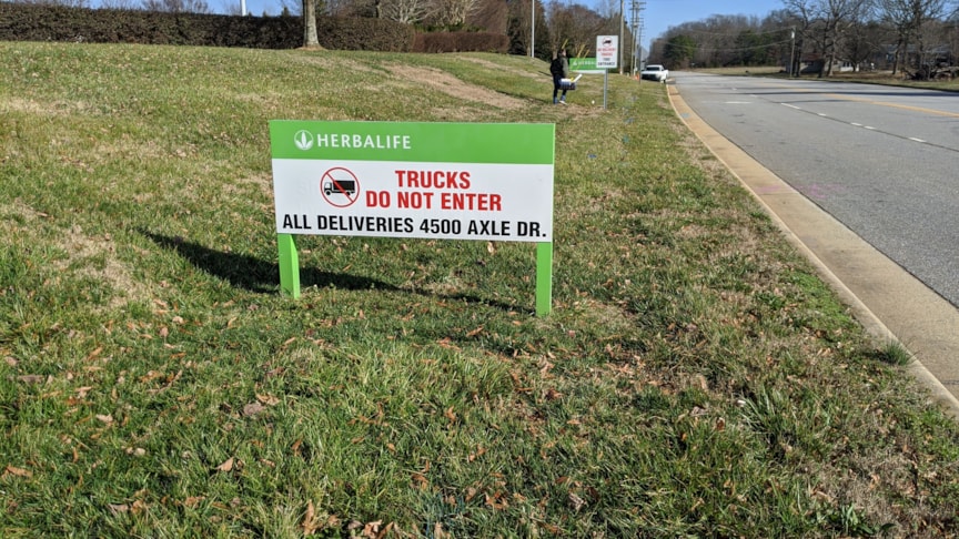 Vinyl Print over out dated metal signage for a fresh new look for Herbalife in Winston-Salem, NC