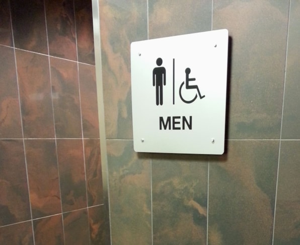ADA restroom sign in silver and black for Gurnee Mills Mall,  Gurnee, IL