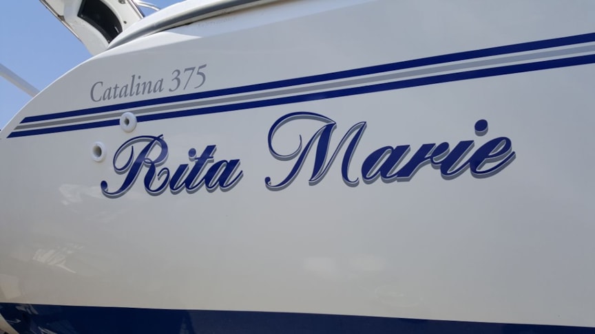 Boat name with outline on side of sailboat at Sail Place Kenosha WI