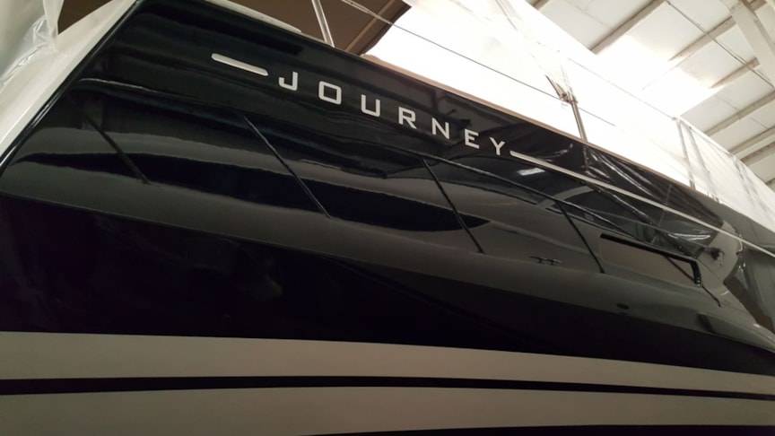 Boat name graphic applied to port and starboard sides at stern.