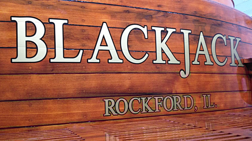 Classic wood boat with gold and black lettering by Signs Now Gurnee