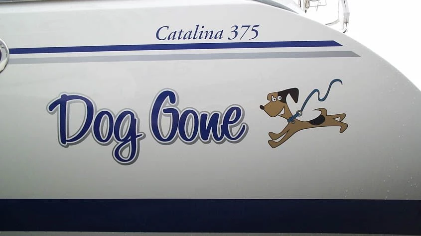 Lettering in blue and silver outline, graphic of dog is printed and cut to shape. Waukegan, IL