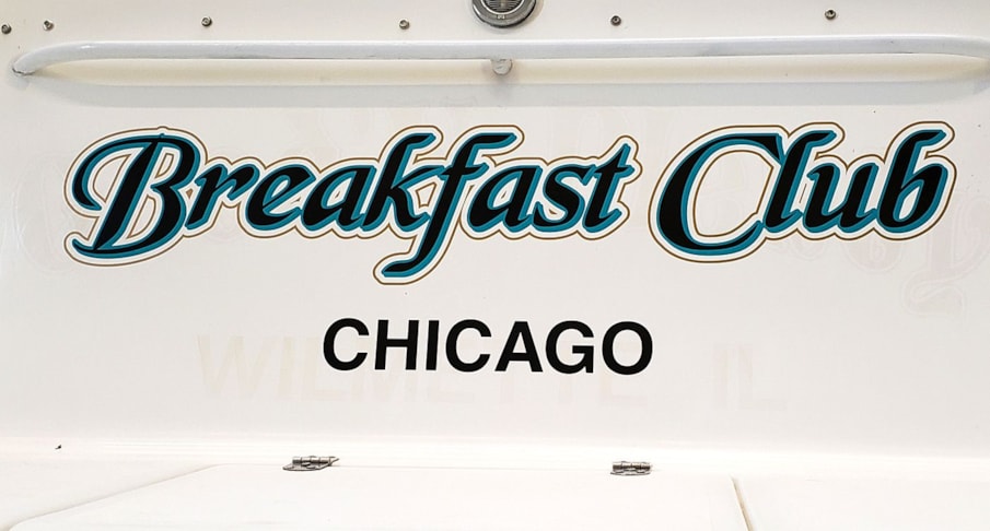 Boat name lettered in three colors to match boat has drop shadow  and metallic gold outline