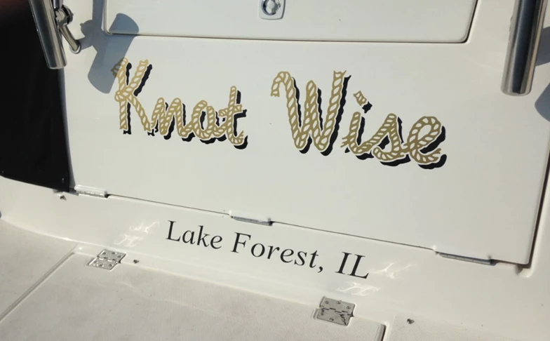 Boat name graphic in metallic gold with drop shadow