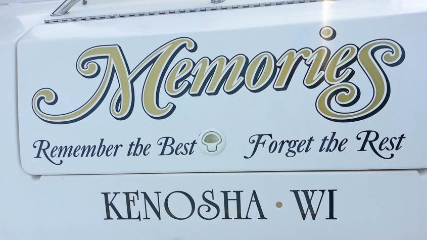 Boat lettering in metallic gold and black at Southport Marina, Kenosha WI.