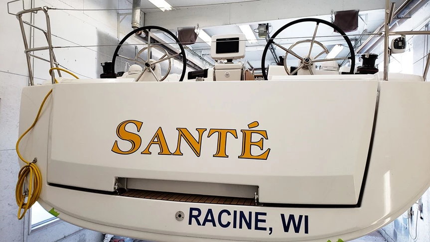 Boat Name Lettering with Hailing Port in Navy Blue and Yellow.  Cool font choice.  