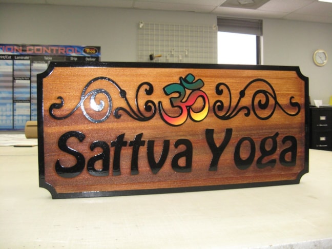 Sandblasted and painted redwood sign