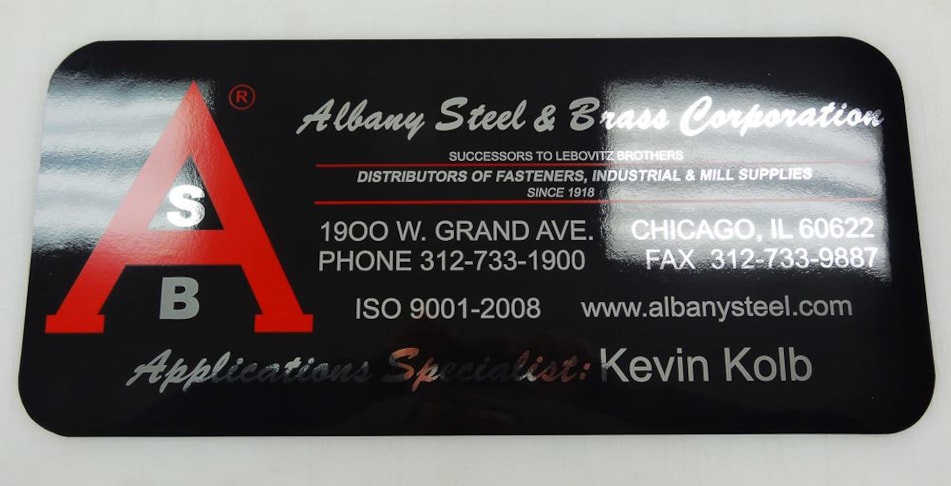 Magnetic enlarged business card with chrome and red on black